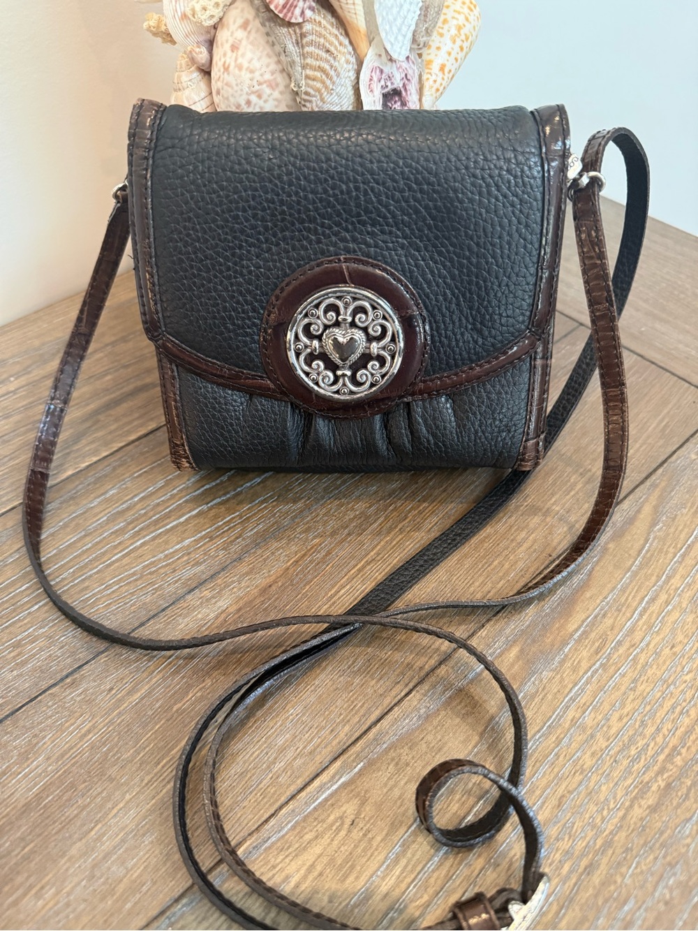 Brighton Black and Brown Leather Crossbody Bag with Decorative Medallion